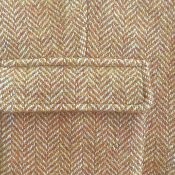 gilet-sans-manches-en-laine-tissage-chevron-orange-detail-poche