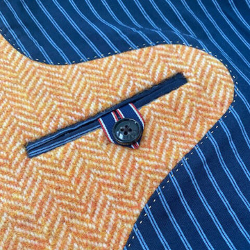 gilet-sans-manches-en-laine-tissage-chevron-orange-detail-poche-interieure